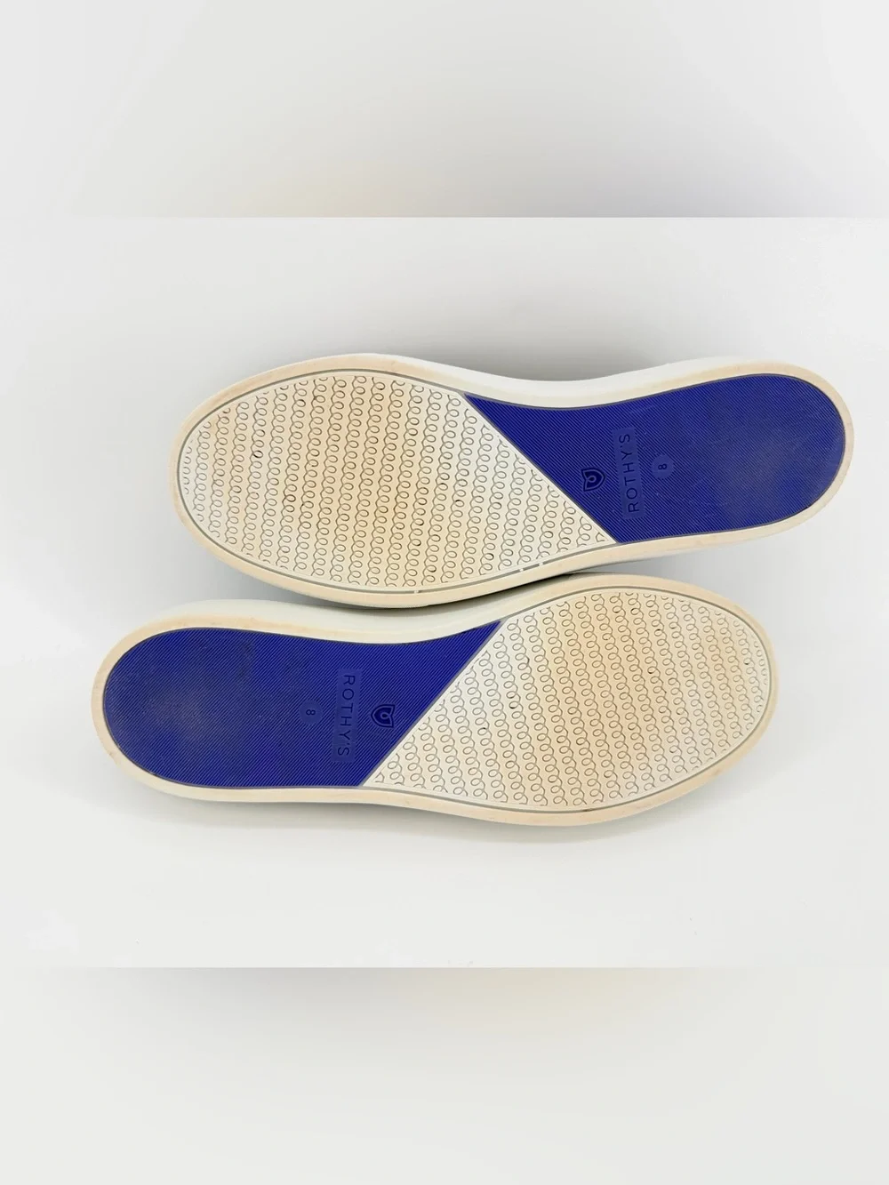 Rothy's Black Knit Original Slip-On Sneakers with Blue & White Heel Tabs